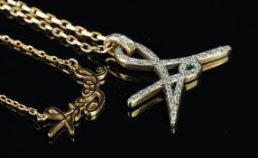 Celebrity memorabilia interest; A diamond set 'A' pendant, mounted in 9ct yellow gold, awarded to