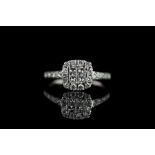 Diamond cluster ring w/ box, 4 princess cut diamonds set to the centre approximately 0.30ct total,