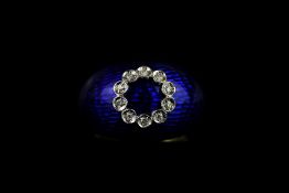 French enamel and diamond dress ring, wide set domed band, blue enamel detail, a halo of diamonds to