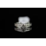 Diamond ring, central round brilliant cut diamond weighing an estimated 0.40ct, with diamond set