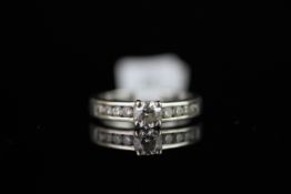 Diamond ring, central round brilliant cut diamond weighing an estimated 0.40ct, with diamond set