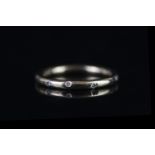 18CT WEDDING BAND SET WITH DIAMONDS, total weight 3.3gms, size leading L 1/2.