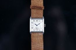 VINTAGE SILVER CASED WRISTWATCH, square white dial, Arabic numerals, subsidiary seconds dial, 27mm