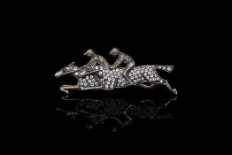 Double horse jockey brooch, diamond set, in yellow and white silver gilt, 5.5cm long,