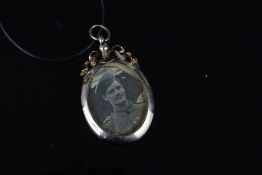 Edwardian locket pendant, double sided glass portrait locket, rose gold frame, bow design to top,
