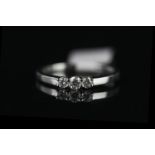 9CT WHITE GOLD THREE STONE DIAMOND RING,estimated 0.25ct total , hallmarked,2.3gms, size leading