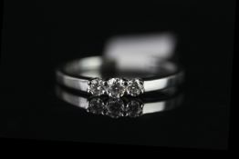 9CT WHITE GOLD THREE STONE DIAMOND RING,estimated 0.25ct total , hallmarked,2.3gms, size leading