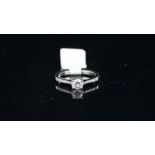 Solitaire brilliant cut diamond ring, with diamond set shoulders, mounted in hallmarked 18ct white