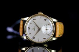 GENTLEMANS 18K OMEGA, round, silver dial with gold hands, gold arabic and baton markers, second