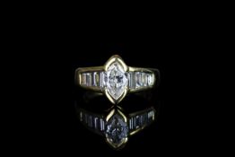 18CT MARQUISE CUT DIAMOND RING,WTH BAQUETTE SHOULDERS, centre stone estimated 1.00ct, total weight