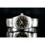 MID SIZE ROLEX OYSTER PERPETUAL , MODEL 6548 CIRCA 1950s,round black dial with gold hands, gold