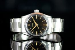 MID SIZE ROLEX OYSTER PERPETUAL , MODEL 6548 CIRCA 1950s,round black dial with gold hands, gold