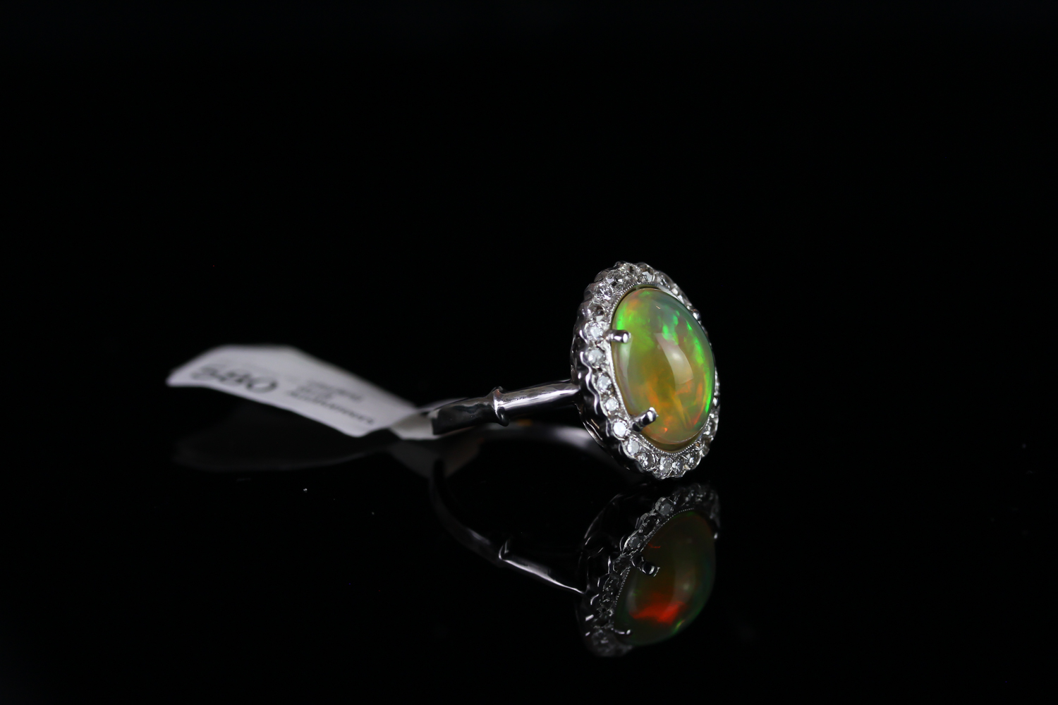 18k OPAL AND DIAMOND CLUSTER RING,centre stone estimated 12x11mm,estimated diamonds total 0.25ct, - Image 2 of 3