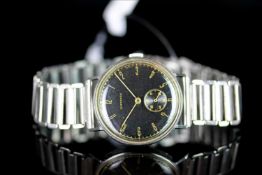 GENTLEMANS VINTAGE LONGINES,round,black dial with gold hands, gold arabic markers, second aperture