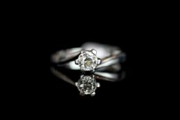 Diamond solitaire ring, set with 1 round brilliant cut diamond, 6 claw set, twist design, stamped