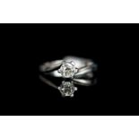 Diamond solitaire ring, set with 1 round brilliant cut diamond, 6 claw set, twist design, stamped
