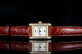 LADIES VOSKI DRESS WATCH WITH DIAMOND SET CASE,REF 510 167,oblong,white dial with gold hands, gold