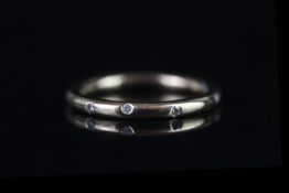 18CT WEDDING BAND SET WITH DIAMONDS, total weight 3.3gms, size leading L 1/2.