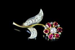 STUNNING 18CT RUBY AND DIAMOND TWO TONE FLOWER BROOCH, total weight 8.57 gms.