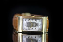 GENTLEMANS 18K VINTAGE MOVADO ,oblong, silver dial with gold hands, gold arabic markers, 35x21mm