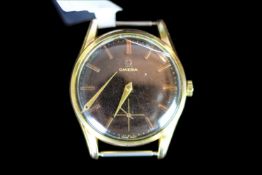 GENTLEMANS 18K OMEGA, round, black dial with gold hands, gold markers, 33mm gold case, manual