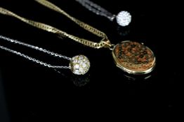 Three chains and necklaces including, 18ct yellow gold oval locket with pierced work front, flat