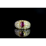 Ruby and Diamond cluster ring, set with 1 oval cut ruby, rubover set, surrounded by round