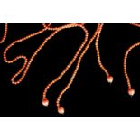 2 x CORAL LARIAT NECKLACES, approximate length 44cm each,