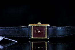 LADIES MUST DE CARTIER TANK,MODEL 09476,oblong , maroon dial with gold hands, 19 16mm gold plated on