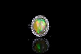 18k OPAL AND DIAMOND CLUSTER RING,centre stone estimated 12x11mm,estimated diamonds total 0.25ct,