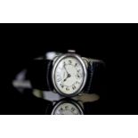 *TO BE SOLD WITHOUT RESERVE* MID SIZE MOVADO SILVER WRISTWATCH CIRCA 1925, oval patina dial with
