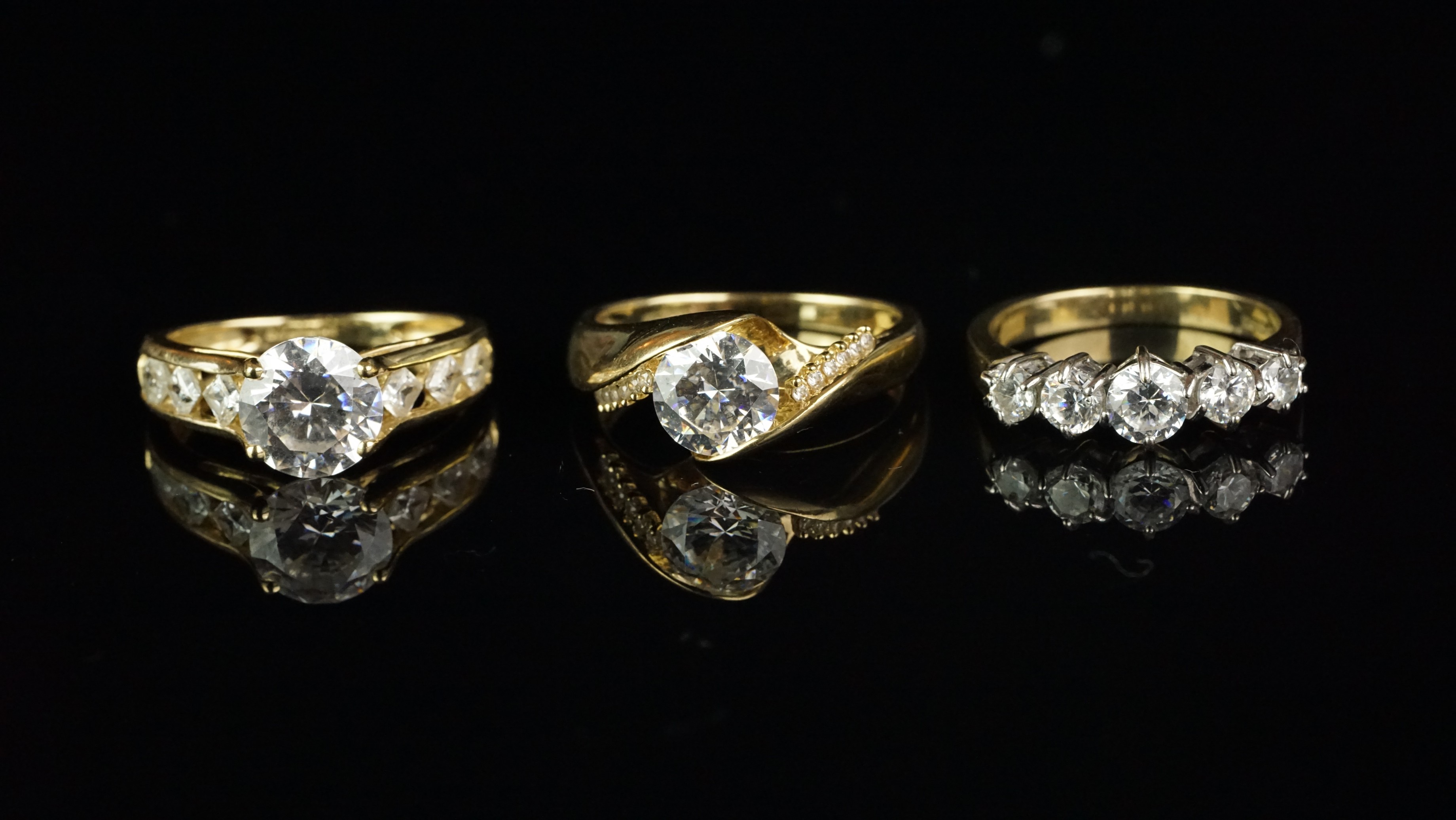 Three cubic zirconia rings, one set in 9ct yellow gold and two set in 14ct yellow gold, total - Image 2 of 2