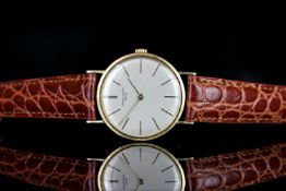 GENTLEMANS VINTAGE PATEK PHILIPPE, round, silver dial with gold hands, gold markers,30mm gold