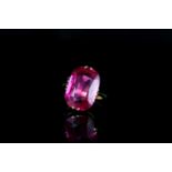 9CT RED STONE DRESS RING, stone estimated 17x10mm. total weight 5.98gms, ring size K.