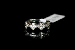 Diamond set dress ring, four four diamond clusters et across, estimated total diamond weight 0.45ct,