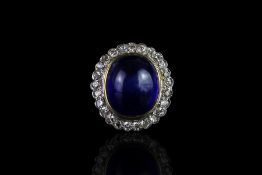 Cabochon sapphire and diamond ring, central cabochon blue sapphire, approximately 13.6x11.4x6.9mm,