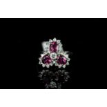 18CT THREE STONE RUBY AND DIAMOND CLUSTER ,rubies estimated at 5x3mm each, diamonds estimated at 0.