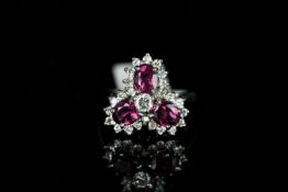 18CT THREE STONE RUBY AND DIAMOND CLUSTER ,rubies estimated at 5x3mm each, diamonds estimated at 0.