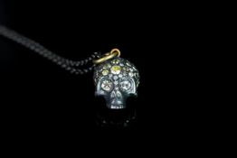 Silver and gold Diamond set skull pendant, approximate total diamond weight 2.46ct, approximate