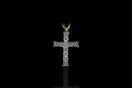 18CT DIAMOND SET CROSS WITH NO CHAIN,stones estimated total weight 0.45ct,hallmarked.