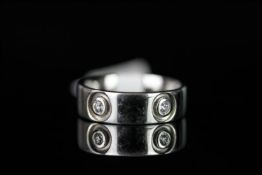A diamond set wedding band, five round brilliant cut diamonds weighing an estimated 0.30ct, set in a