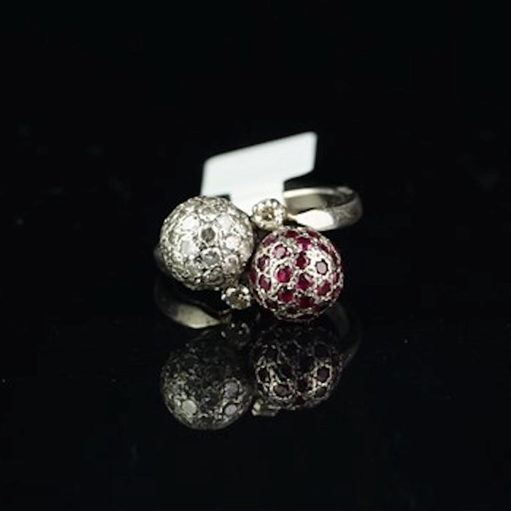 Ruby and diamond crossover ball ring, one set with rubies, the other diamonds, mounted in unmarked - Image 2 of 2