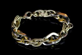 18ct bi colour fancy link bracelet, in yellow and white gold with polished and textured links, 22.