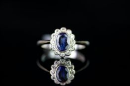 18CT WHITE GOLD SAPPHIRE AND DIAMOND CLUSTER RING, sapphire estimated 7 x 4.8mm, total weight 4.