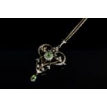 9CT PERIDOT AND SEED PEARL PENDANT /BROOCH, total weight 7.8gms.