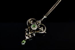 9CT PERIDOT AND SEED PEARL PENDANT /BROOCH, total weight 7.8gms.