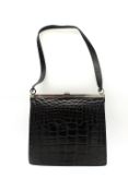 Loewe, black crocodile skin, with small black leather shoulder strap, with silver hardware. W26cm