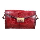 Stunning Prada sound bag in shiny red crocodile skin with gold tone hardware. Can convert to a