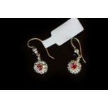 Edwardian Ruby and Diamond cluster drop earrings, central round cut Ruby with a border of rose cut