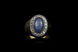Star sapphire and diamond signet ring, cabochon blue star sapphire, 11x6.5mm, diamond surround,